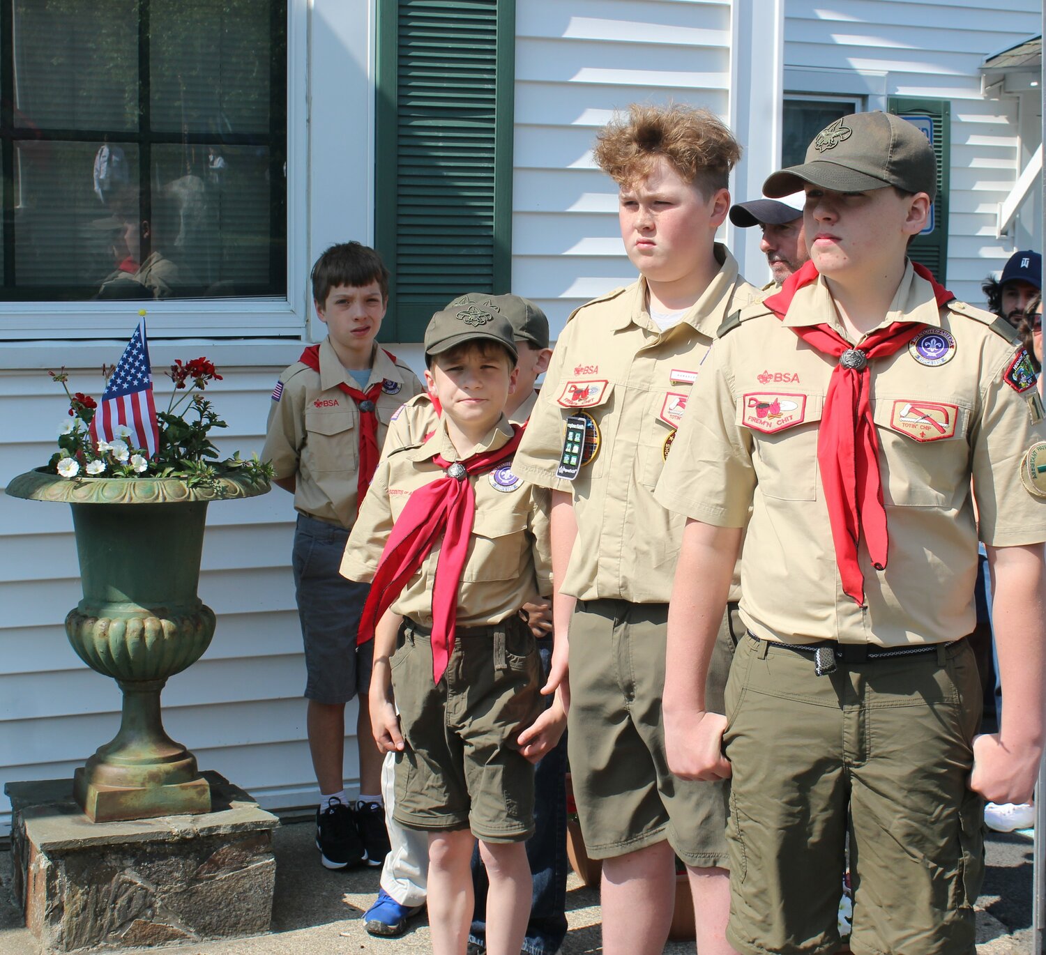 Scouts from Troop 102 stand ready to lay flowers at the war memorials in Lumberland.